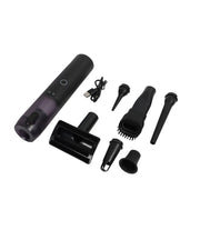 Black handheld vacuum with various attachments on a white background