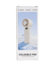 Cream foldable cooling fan in fully opened position showing fan blades, USB-C port, and extended handle design