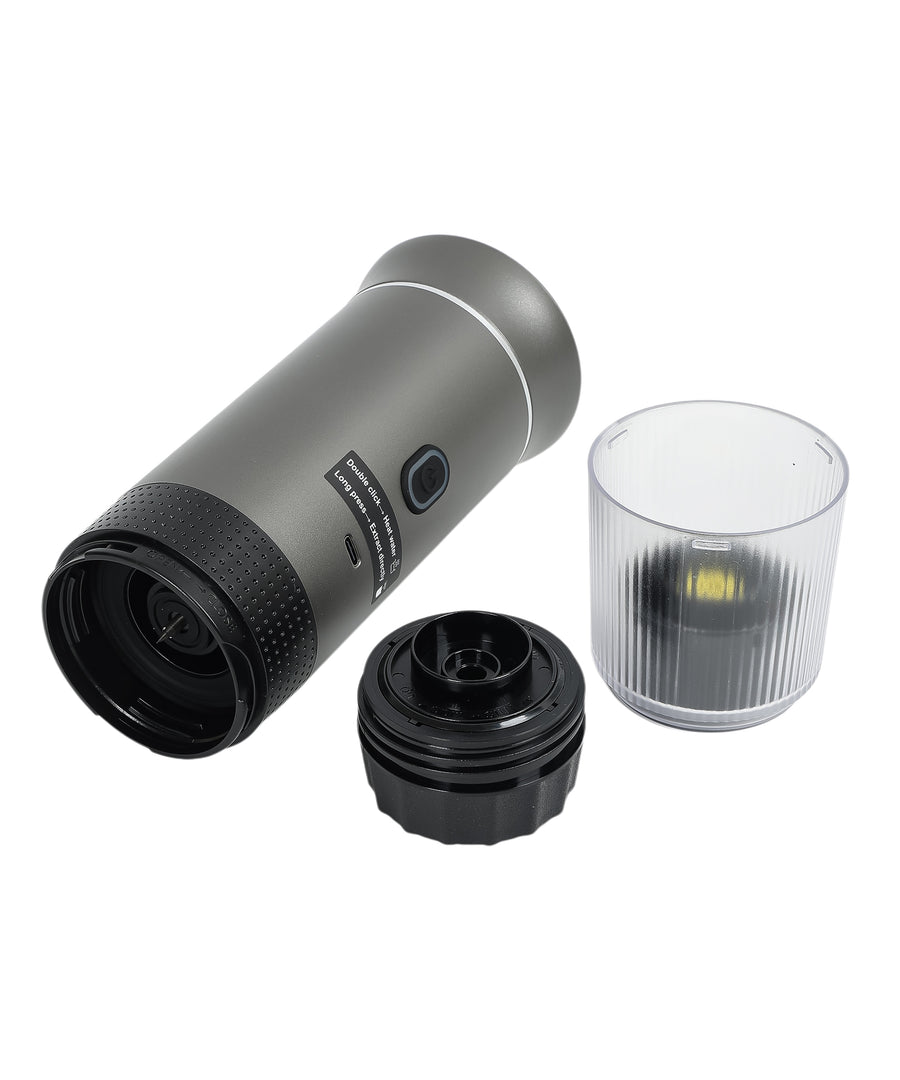 Gray 3-in-1 portable espresso maker fully disassembled showing main unit, black brewing components, transparent collection cup, and all detachable parts