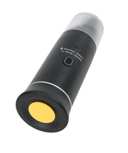 Black portable espresso maker side view displaying cylindrical design, power button, USB-C port, and transparent collection base