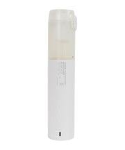 White cylindrical vacuum cleaner with a label on a white background